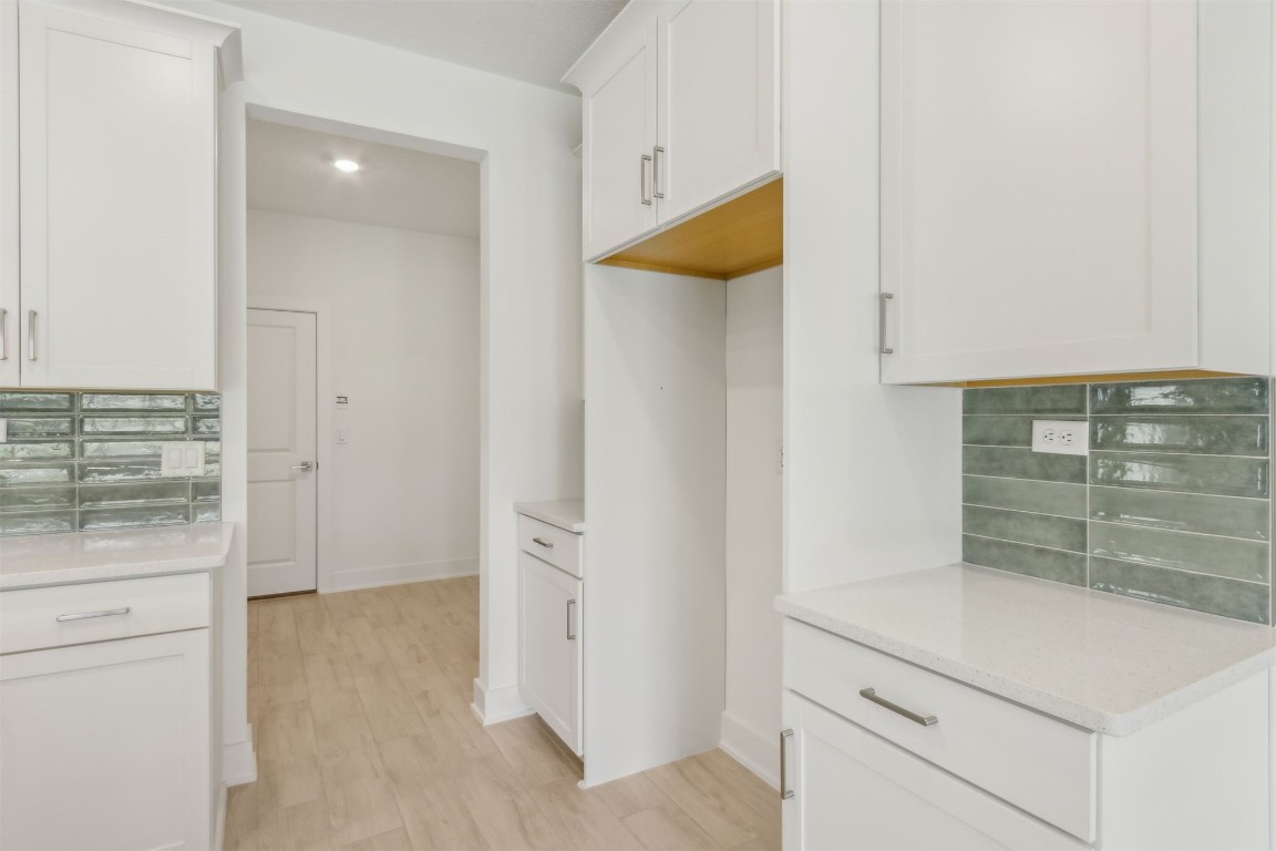 96088 Pirates Bluff Road Yulee, FL 32097 - Photo 12 of 25 a kitchen with a stove and a refrigerator