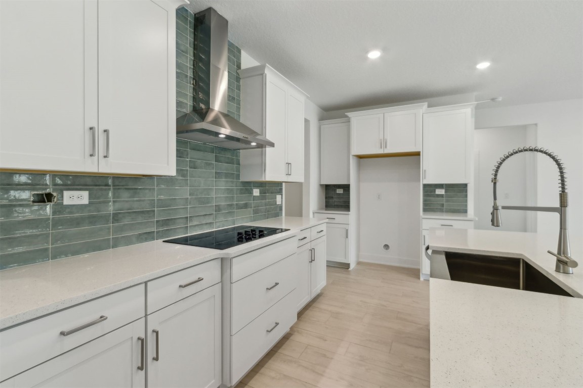 96088 Pirates Bluff Road Yulee, FL 32097 - Photo 2 of 25 a kitchen with granite countertop a sink stainless steel appliances and cabinets