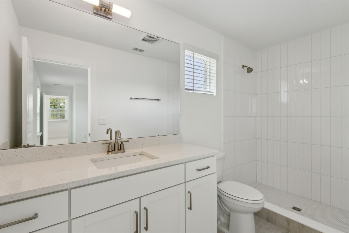 96088 Pirates Bluff Road Yulee, FL 32097 - Photo 21 of 25 a bathroom with a sink toilet and shower
