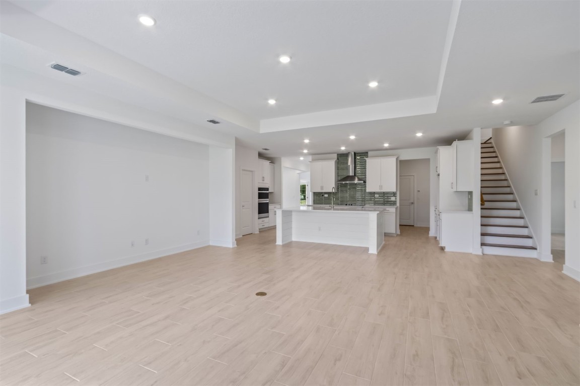 96088 Pirates Bluff Road Yulee, FL 32097 - Photo 5 of 25 a view of a kitchen with white cabinets and stainless steel appliances