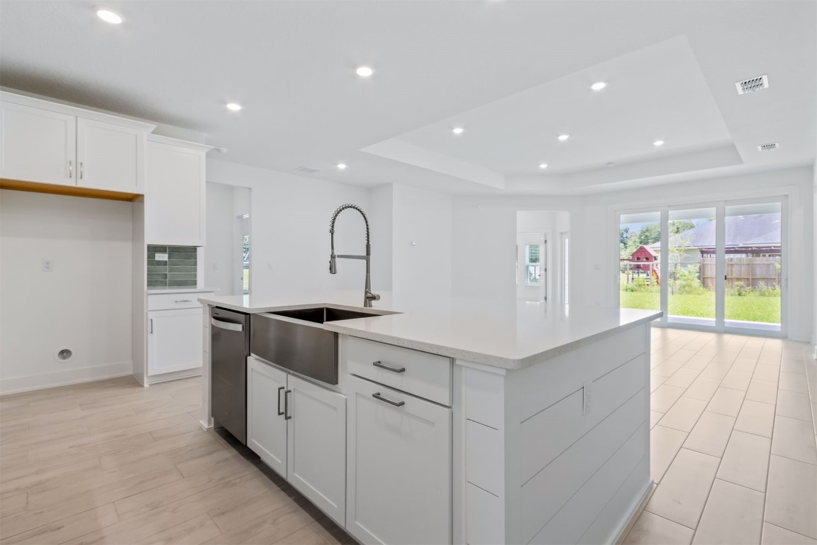96088 Pirates Bluff Road Yulee, FL 32097 - Photo 9 of 25 a kitchen with white cabinets and sink