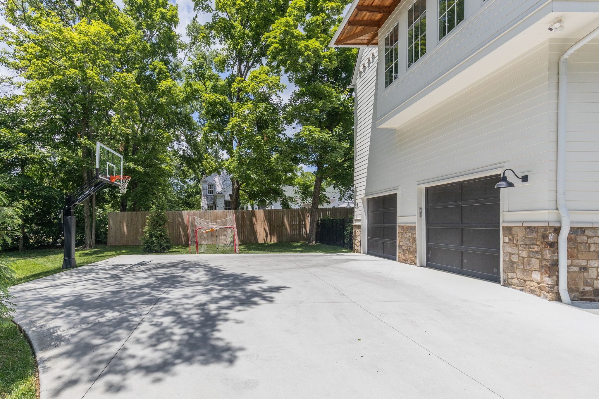 2402 Valley Brook Road Nashville, TN 37215 - Photo 70 of 75 a front view of a house with a yard and garage