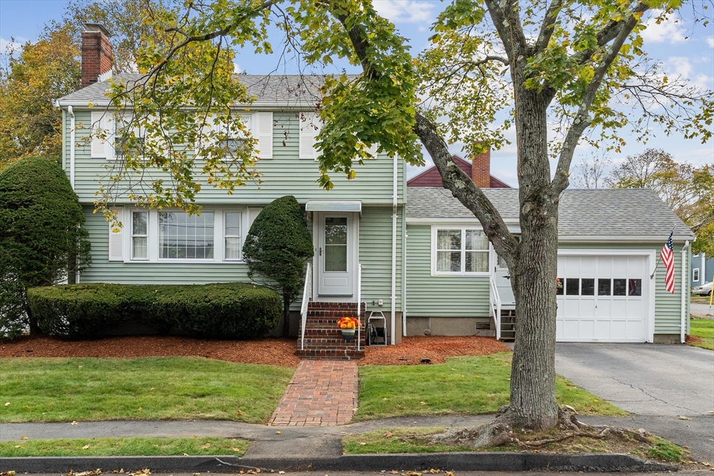 9 Pershing Road Salem, MA 01970 - Photo 2 of 42 a front view of a house with garden
