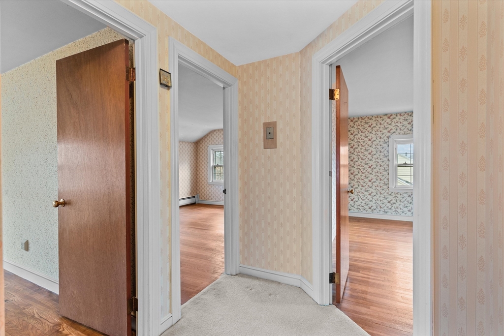 9 Pershing Road Salem, MA 01970 - Photo 22 of 42 a view of hallway with wooden floor