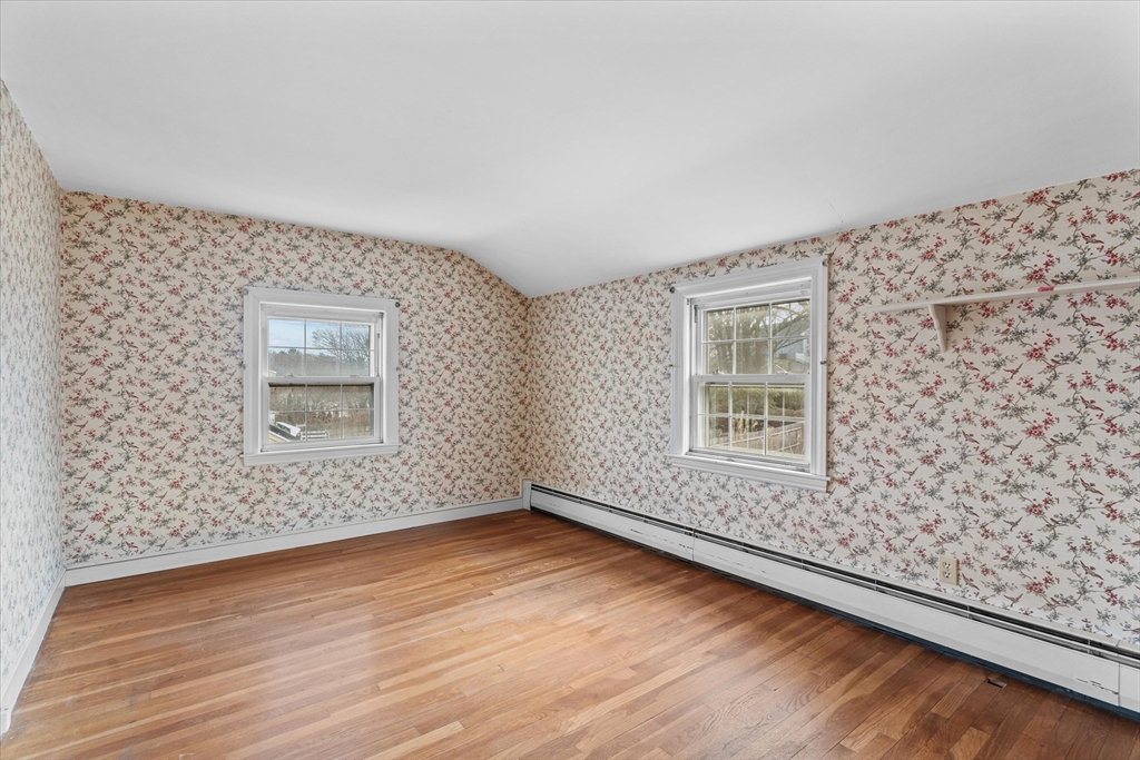 9 Pershing Road Salem, MA 01970 - Photo 24 of 42 wooden floor in an empty room with a window