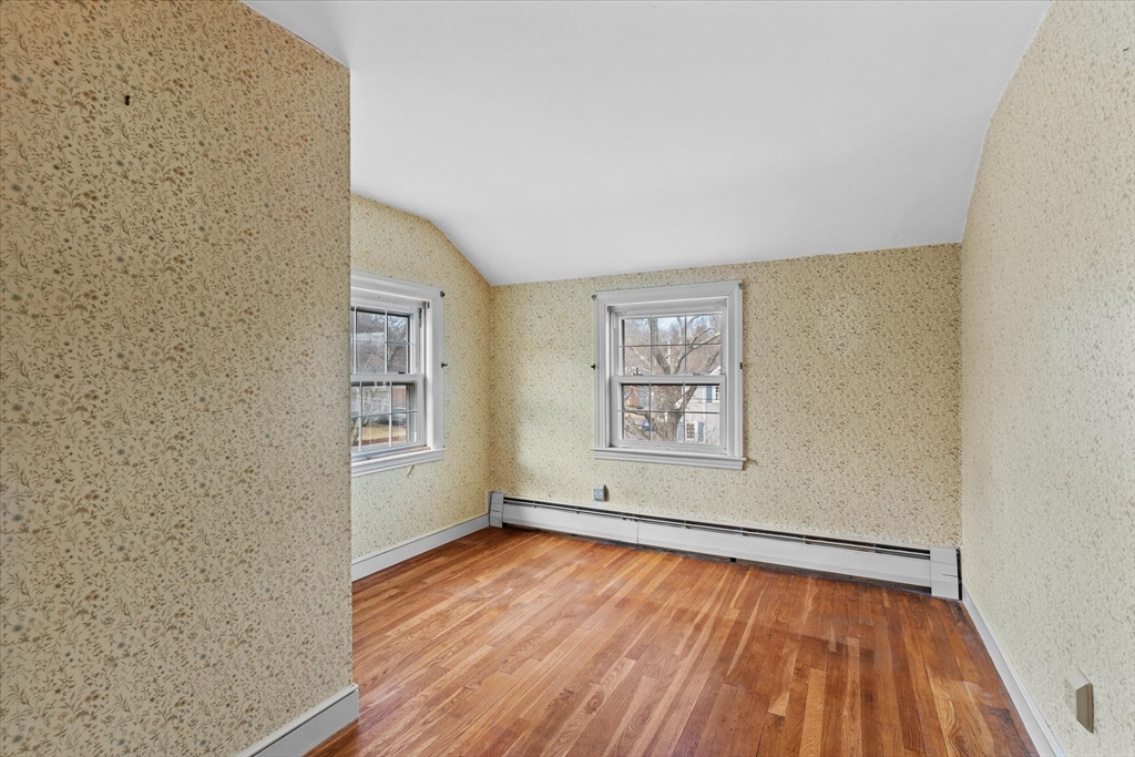 9 Pershing Road Salem, MA 01970 - Photo 28 of 42 wooden floor in an empty room with a window