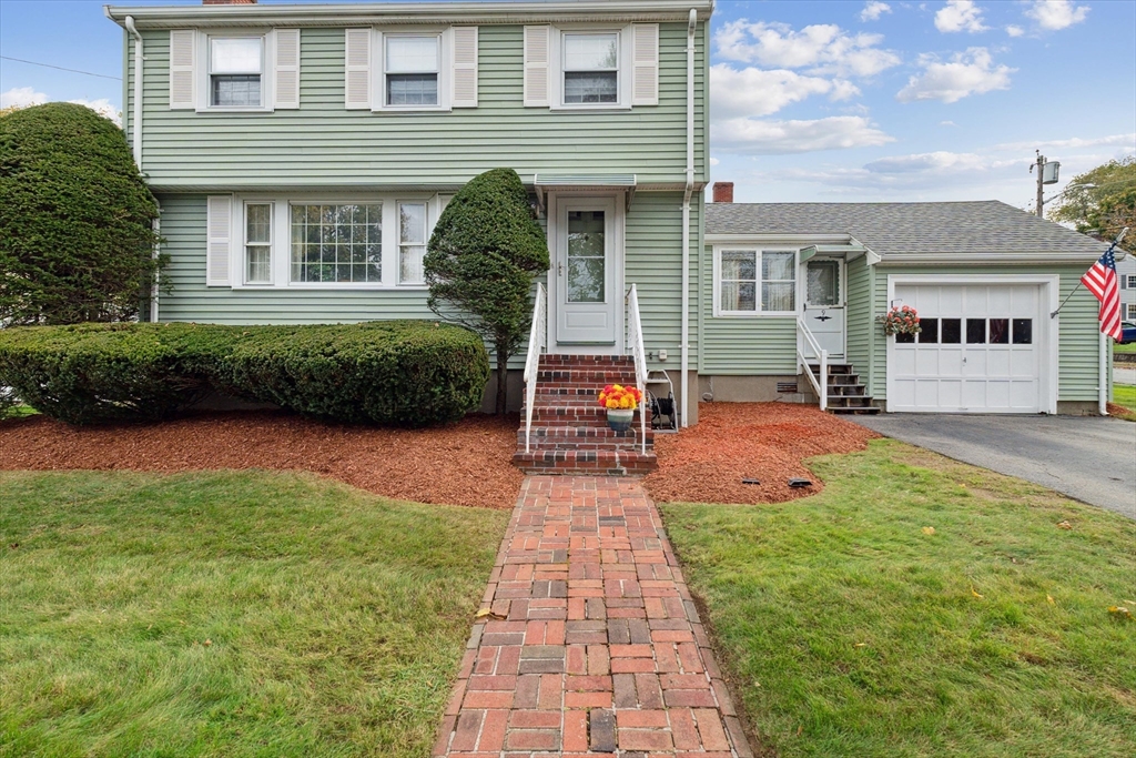 9 Pershing Road Salem, MA 01970 - Photo 40 of 42 a front view of a house with a yard