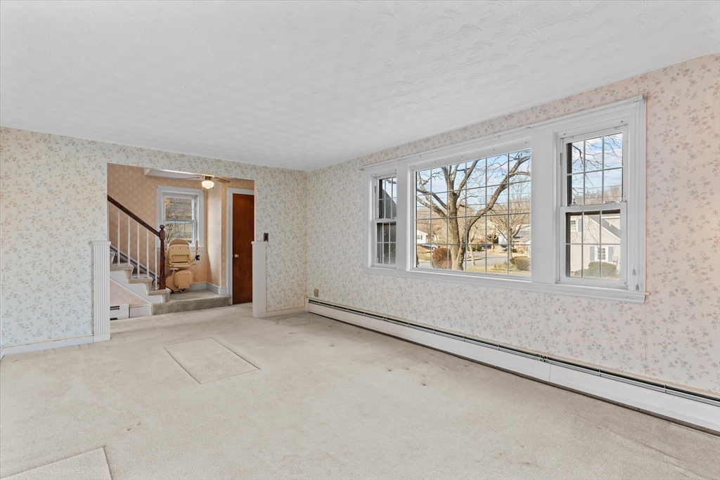 9 Pershing Road Salem, MA 01970 - Photo 7 of 42 an empty room with windows