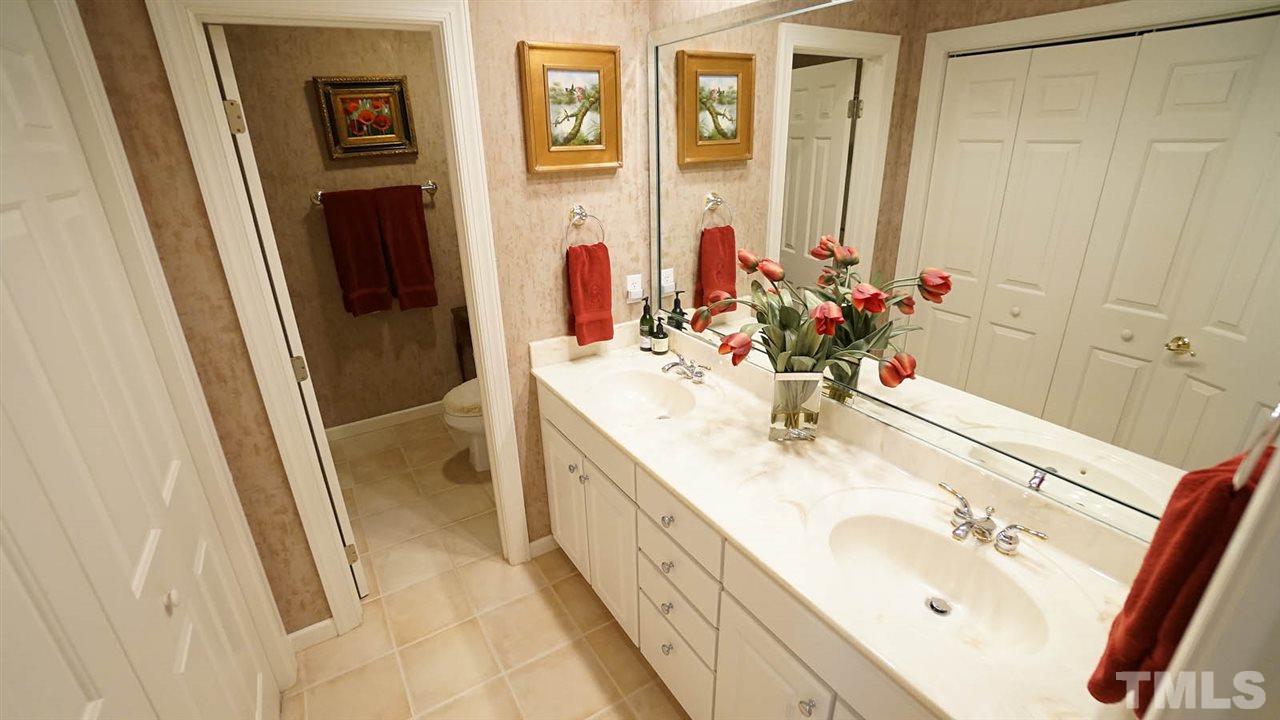 1900 Torrington Street Raleigh, NC 27615 - Photo 22 of 30 Updated shower w/ sliding glass door(2018), double vanity, good closet space