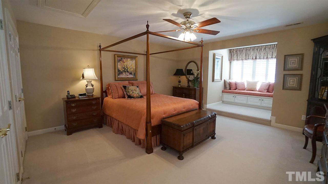 1900 Torrington Street Raleigh, NC 27615 - Photo 23 of 30 Spacious private guest suite w/ double closet area, and built in seating area w/ storage. Additional pull down storage with sealed attic for ultimate energy efficiency