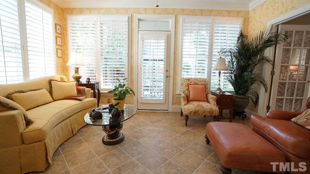 1900 Torrington Street Raleigh, NC 27615 - Photo 7 of 30 Amazing light filled sunroom with convenient access from the family room and master bedroom. Relaxing, comfortable, good size, and great views of the amazing yard. Tile floor