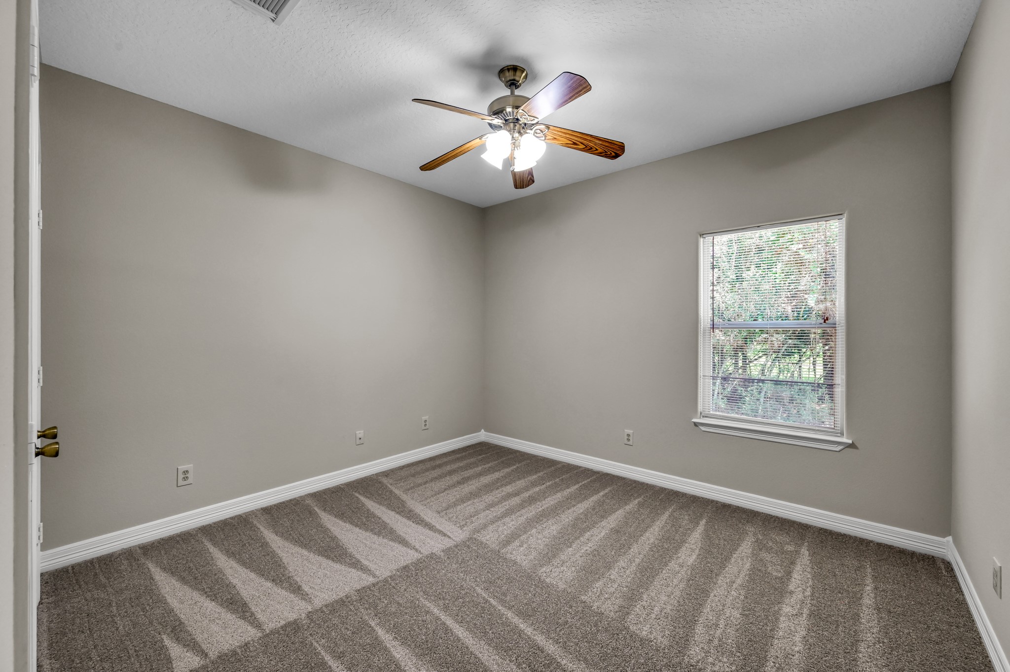 9606 Miller Road Magnolia, TX 77354 - Photo 26 of 41 Bedroom 3 is en-suite with hall access to bathroom.