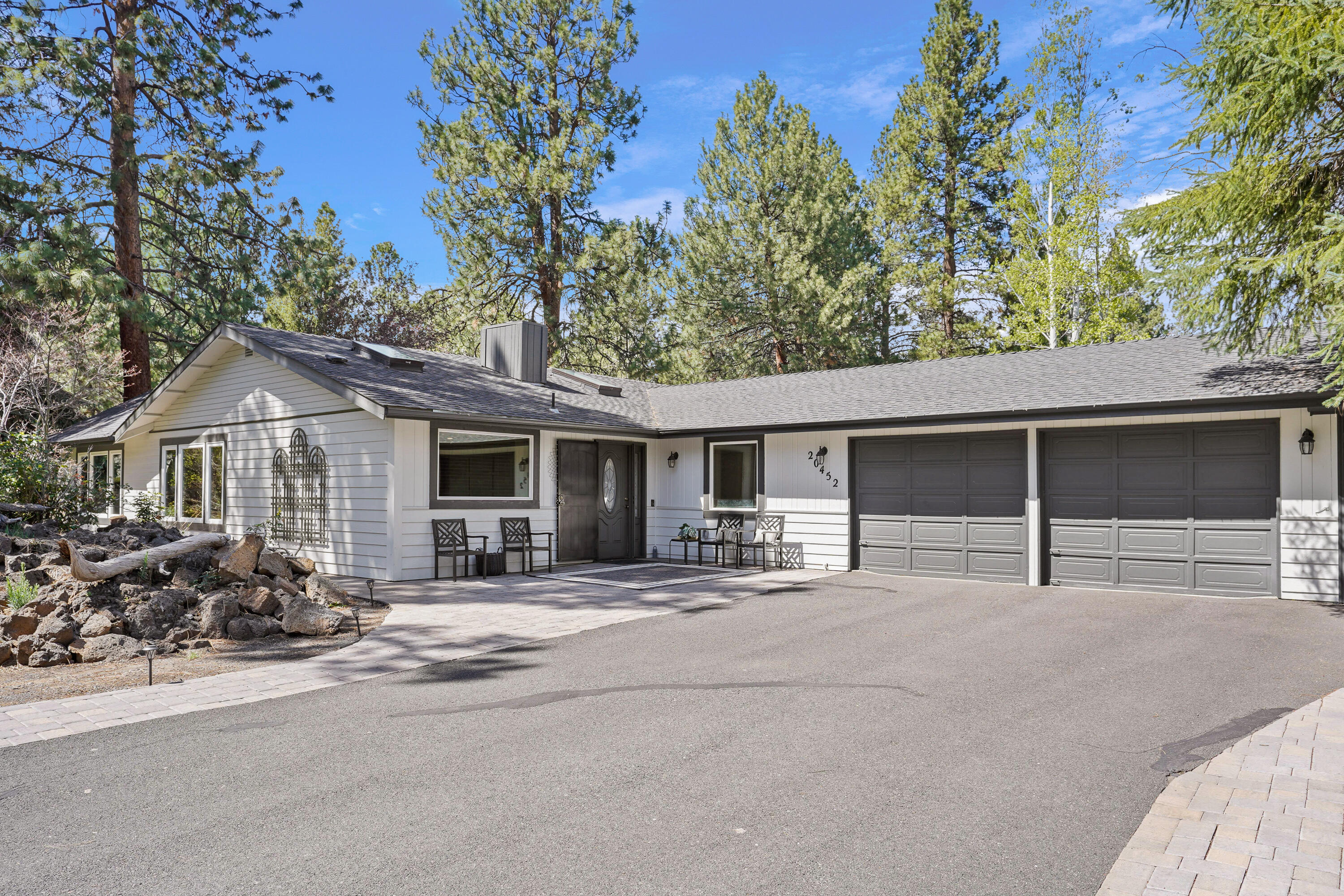 20452 Mainline Road Bend, OR 97702 - Photo 1 of 40 a view of a house with a yard and large tree