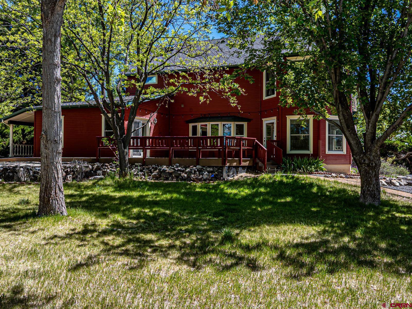 16331 2550th Road Cedaredge, CO 81413 - Photo 35 of 45 a front view of a house with garden