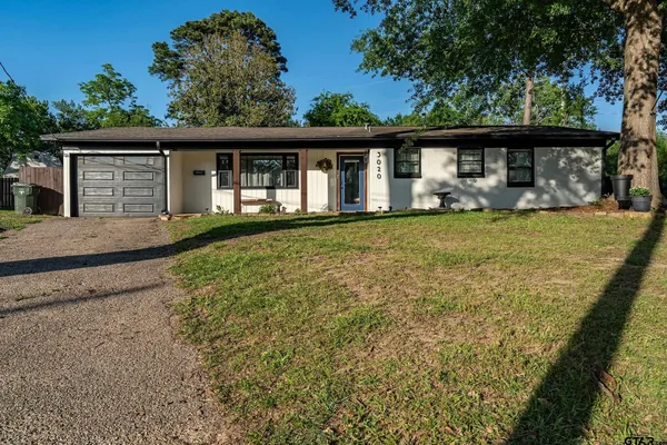 front view of a house with a big yard