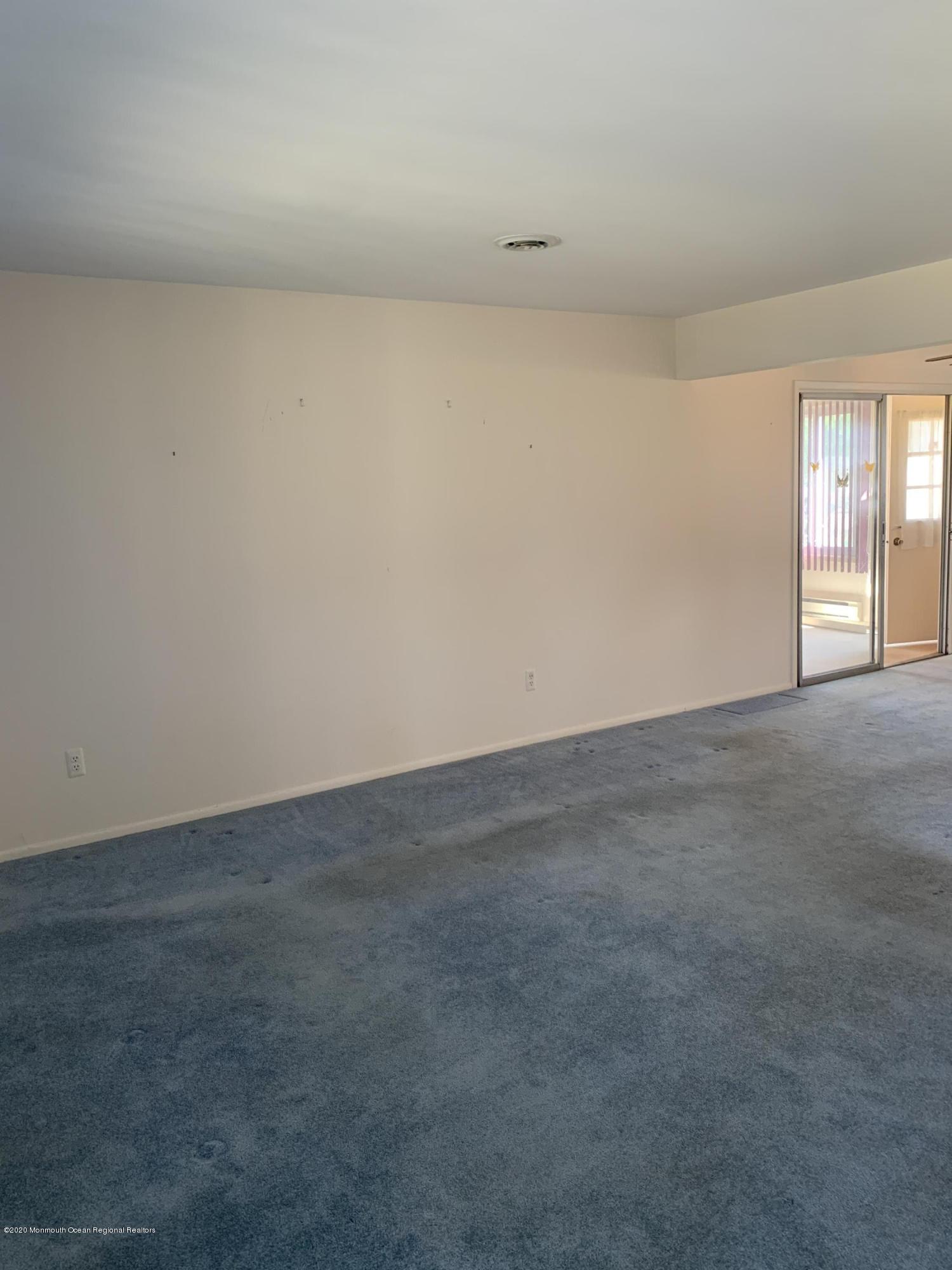 129 Georgetown Road Toms River, NJ 08757 - Photo 3 of 15 a view of an empty room and window