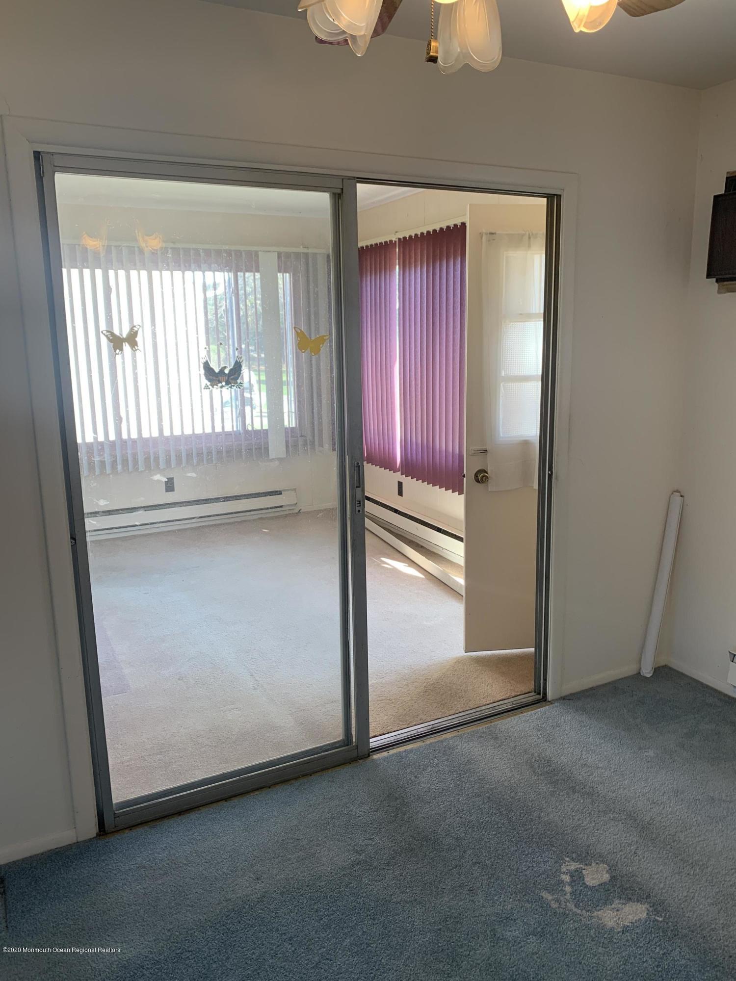 129 Georgetown Road Toms River, NJ 08757 - Photo 4 of 15 an empty room with windows