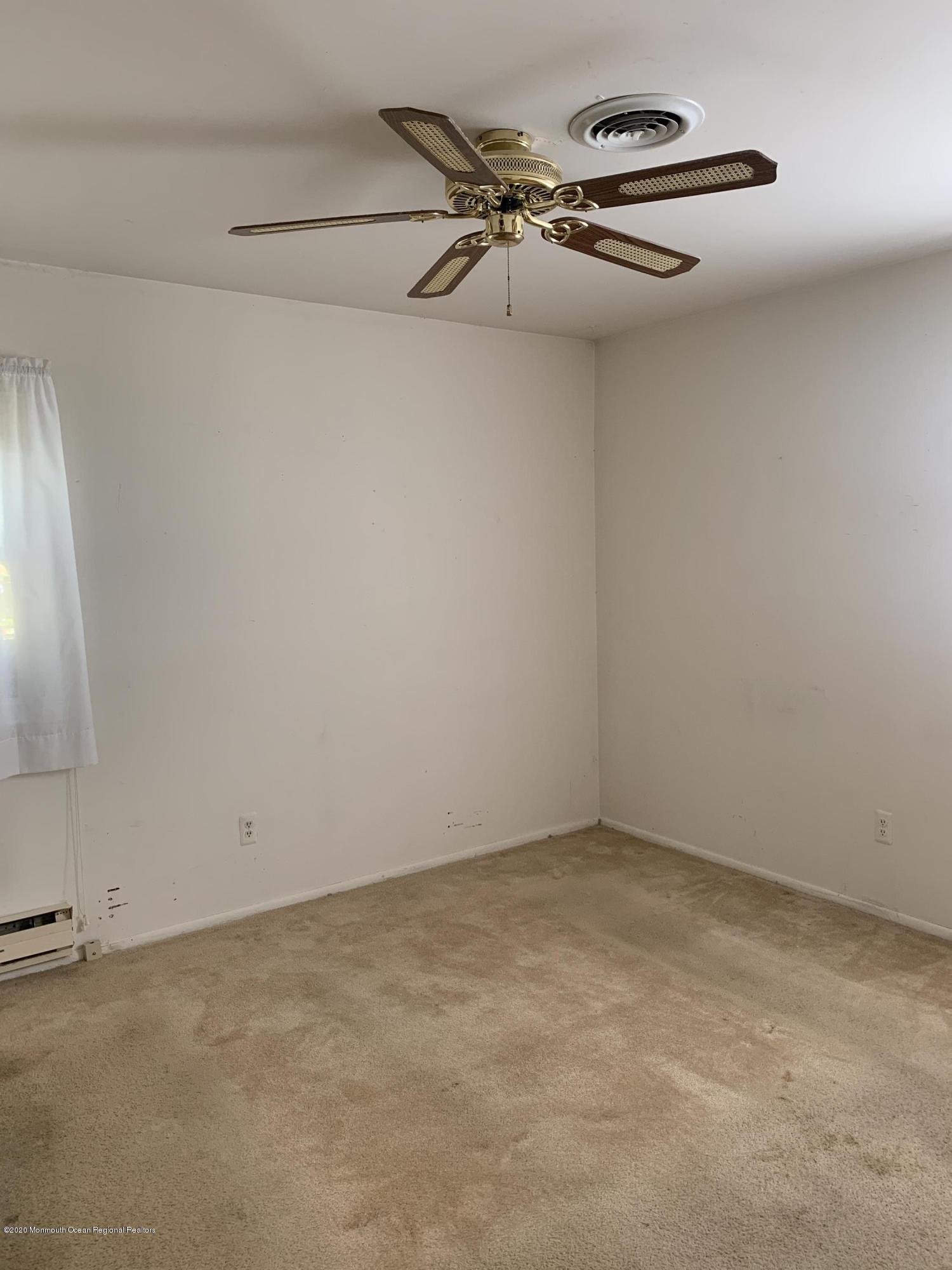 129 Georgetown Road Toms River, NJ 08757 - Photo 9 of 15 a view of a room with racks on the wall