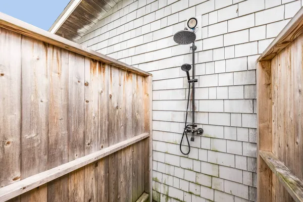 a bathroom with a shower and a sink