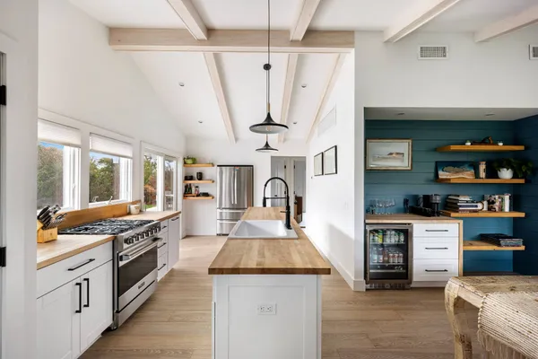 a kitchen with stainless steel appliances granite countertop a stove and a cabinets