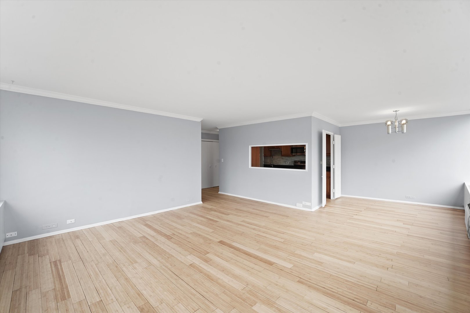 5757 North Sheridan Road, Unit 5J Chicago, IL 60660 - Photo 11 of 44 a view of empty room with wooden floor and fan