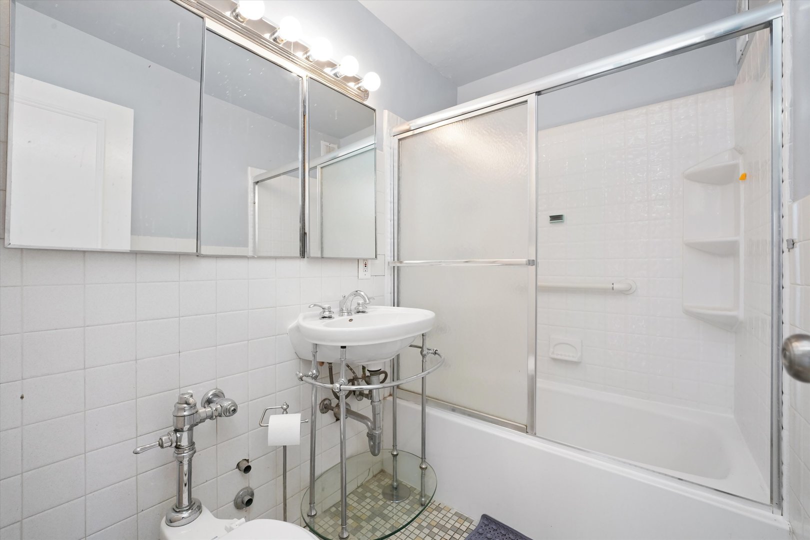 5757 North Sheridan Road, Unit 5J Chicago, IL 60660 - Photo 23 of 44 a bathroom with a shower and a sink