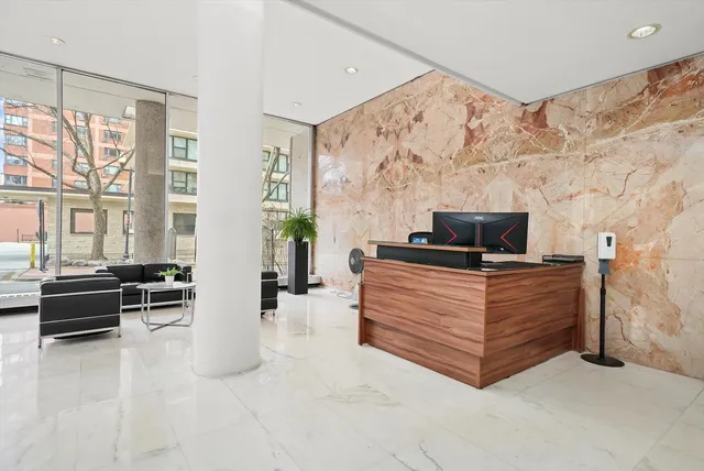 a bedroom with furniture and flat screen tv