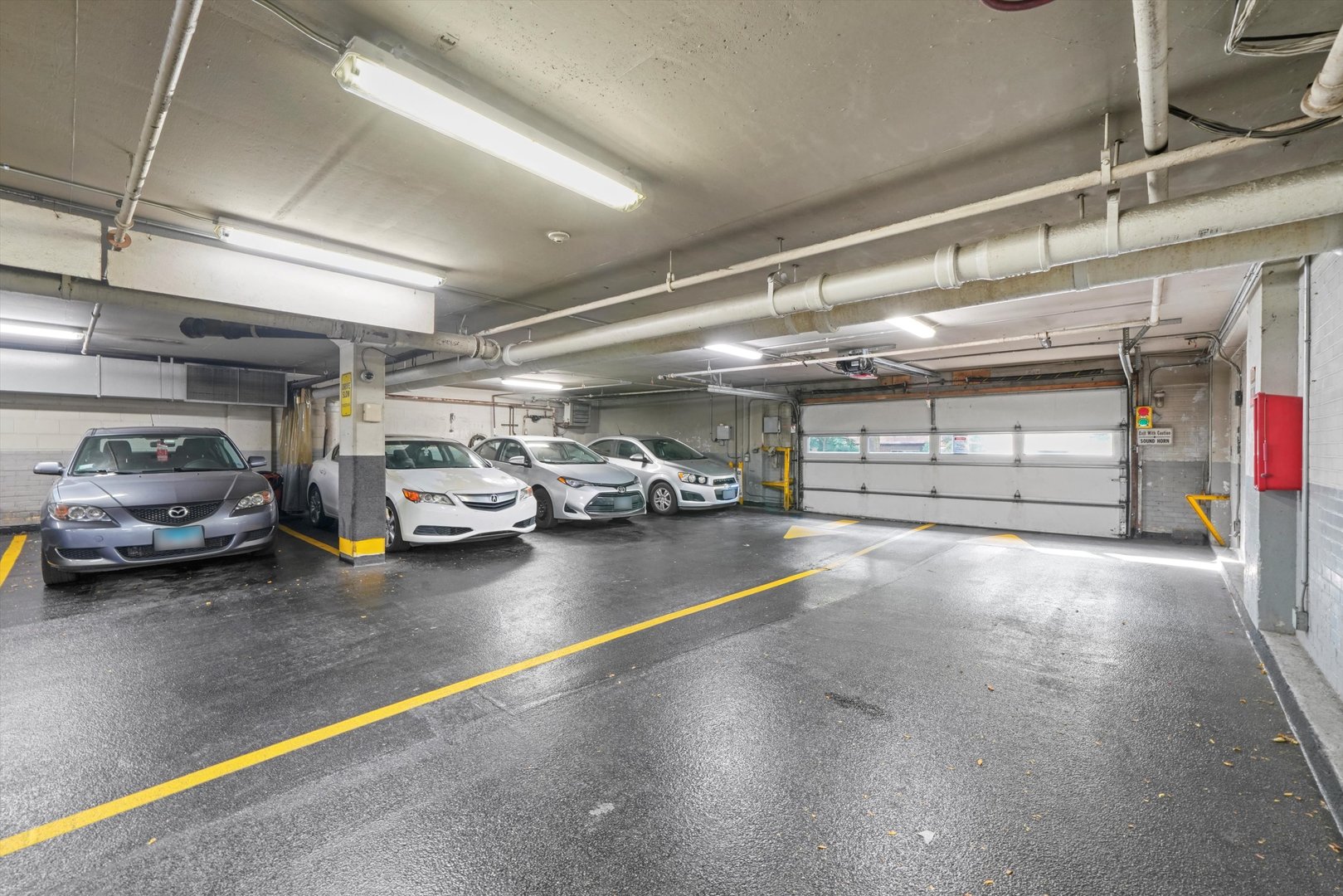 5757 North Sheridan Road, Unit 5J Chicago, IL 60660 - Photo 30 of 44 a view of parking garage with cars
