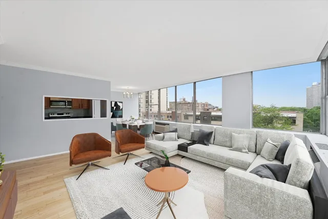 a living room with furniture a rug and a large window