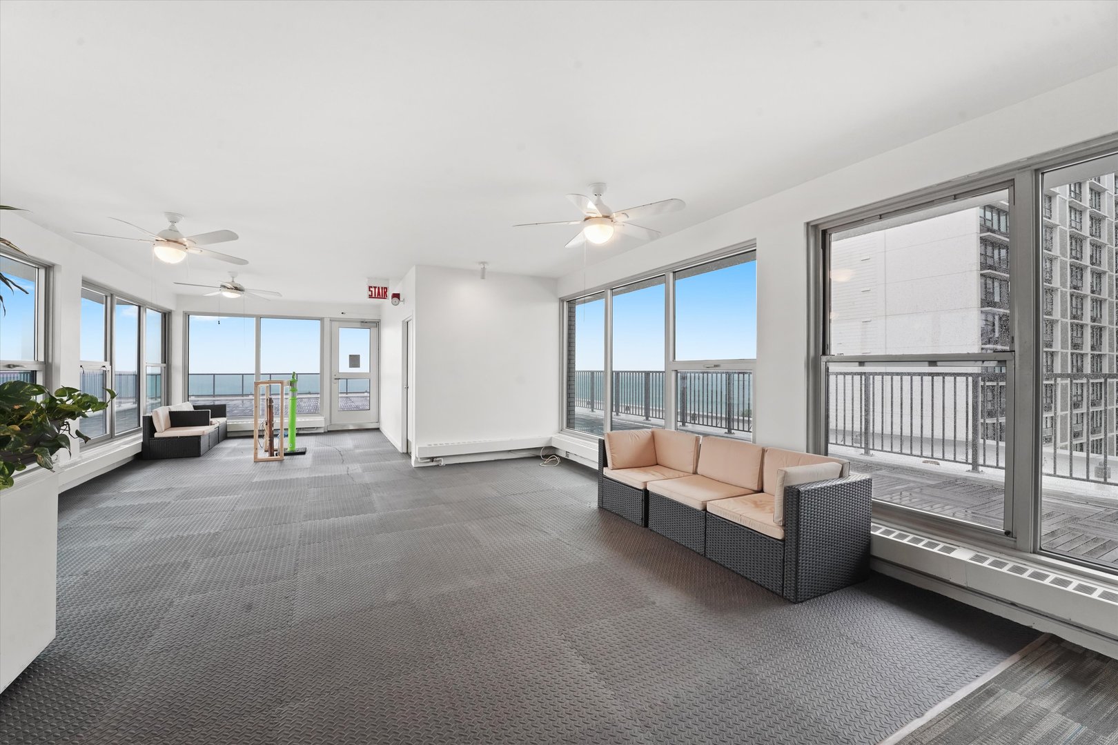 5757 North Sheridan Road, Unit 5J Chicago, IL 60660 - Photo 35 of 44 a living room with furniture and a large window