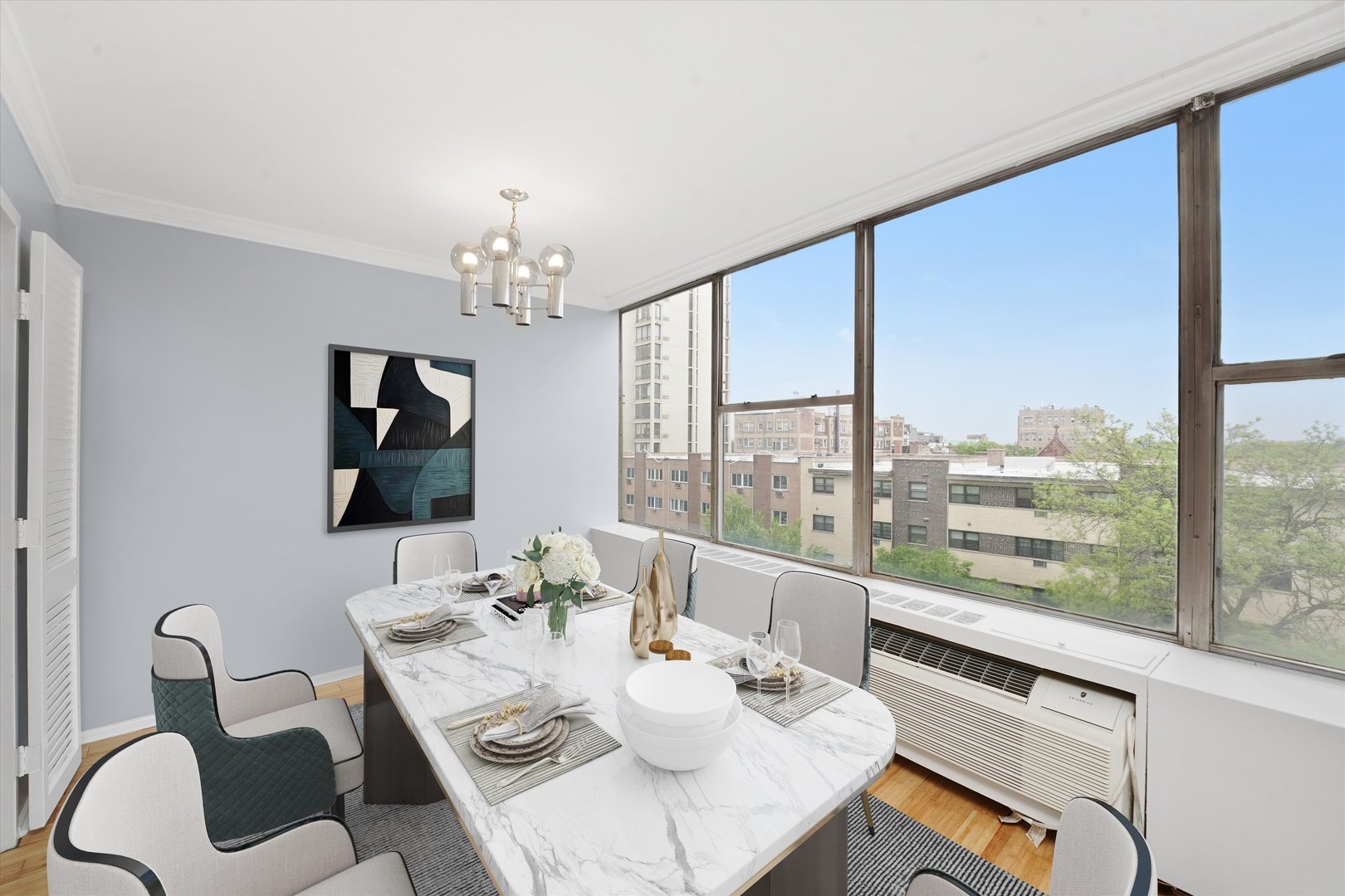 5757 North Sheridan Road, Unit 5J Chicago, IL 60660 - Photo 4 of 44 a view of a dining room with furniture window and outside view