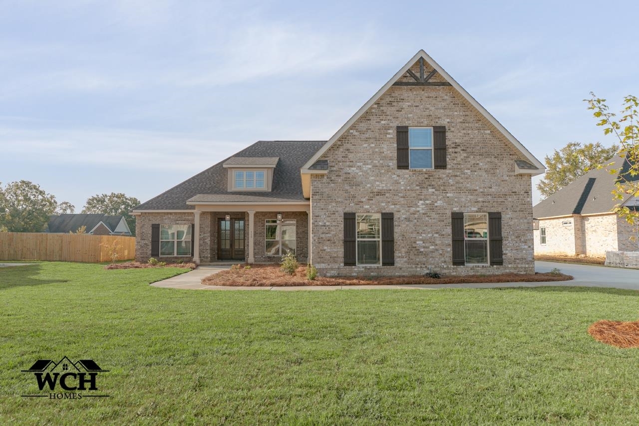 115 Flat Rock Lane, Unit 8A Perry, GA 31069 - Photo 1 of 1 a front view of house with yard and green space