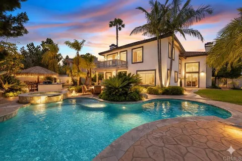 a view of a house with swimming pool