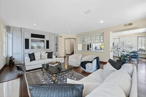 a bathroom with a sink vanity mirror and toilet