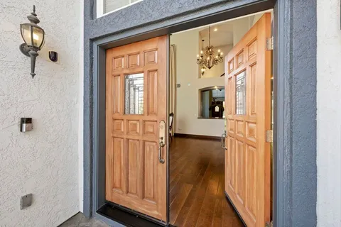 a living room with furniture a fireplace and a window