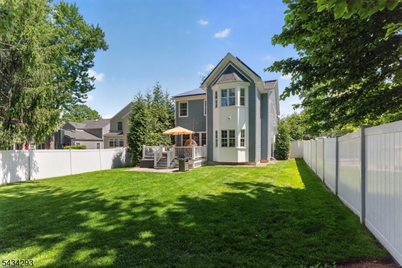 921 Harding Street Westfield, NJ 07090 - Photo 48 of 50 a front view of a house with a yard and trees