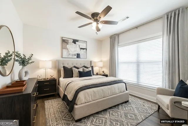 a bedroom with bed and window