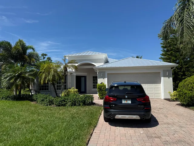 a car parked in front of a house