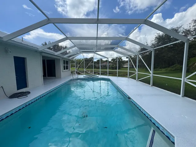 a view of a house with a swimming pool
