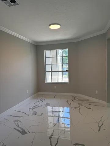 a view of empty room with windows