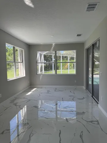 a bathroom with double vanity white cabinets and a mirror