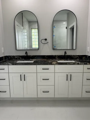 a bathroom with a bathtub and shower