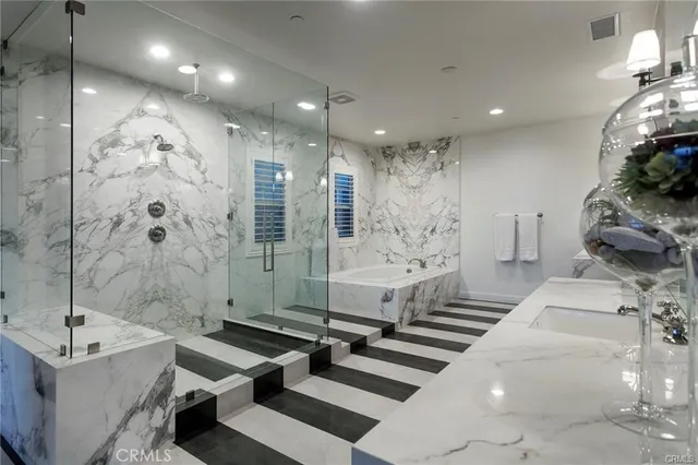 a bathroom with a bathtub and a shower