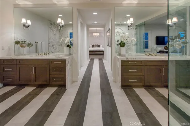a spacious bathroom with a sink and a mirror