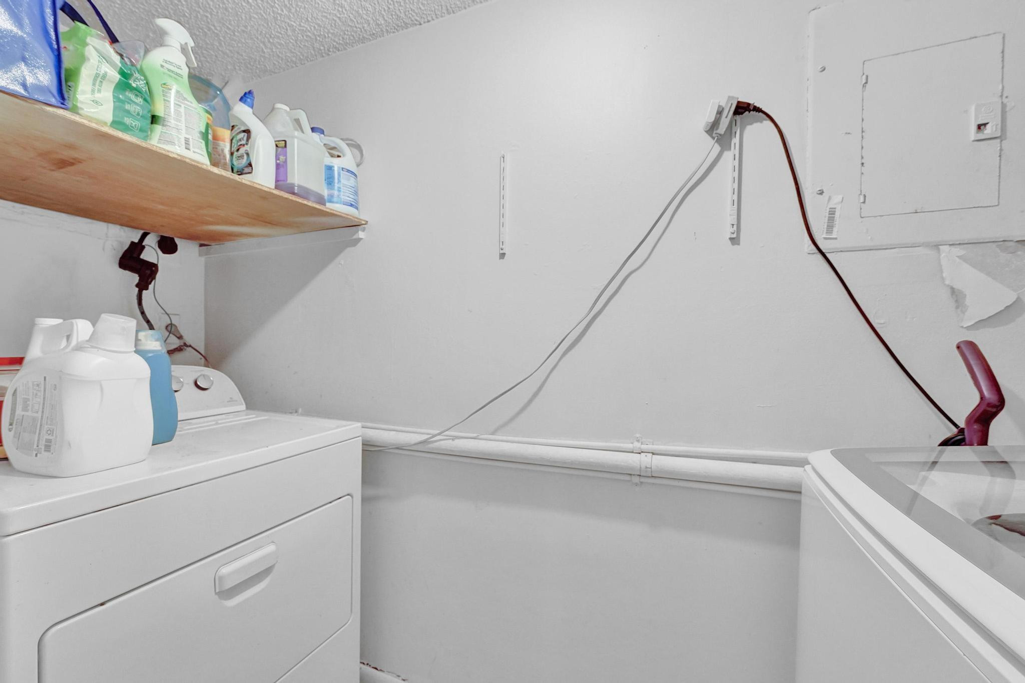 3396 Foxcroft Road, Unit 106 Miramar, FL 33025 - Photo 13 of 24 a utility room with dryer and washer