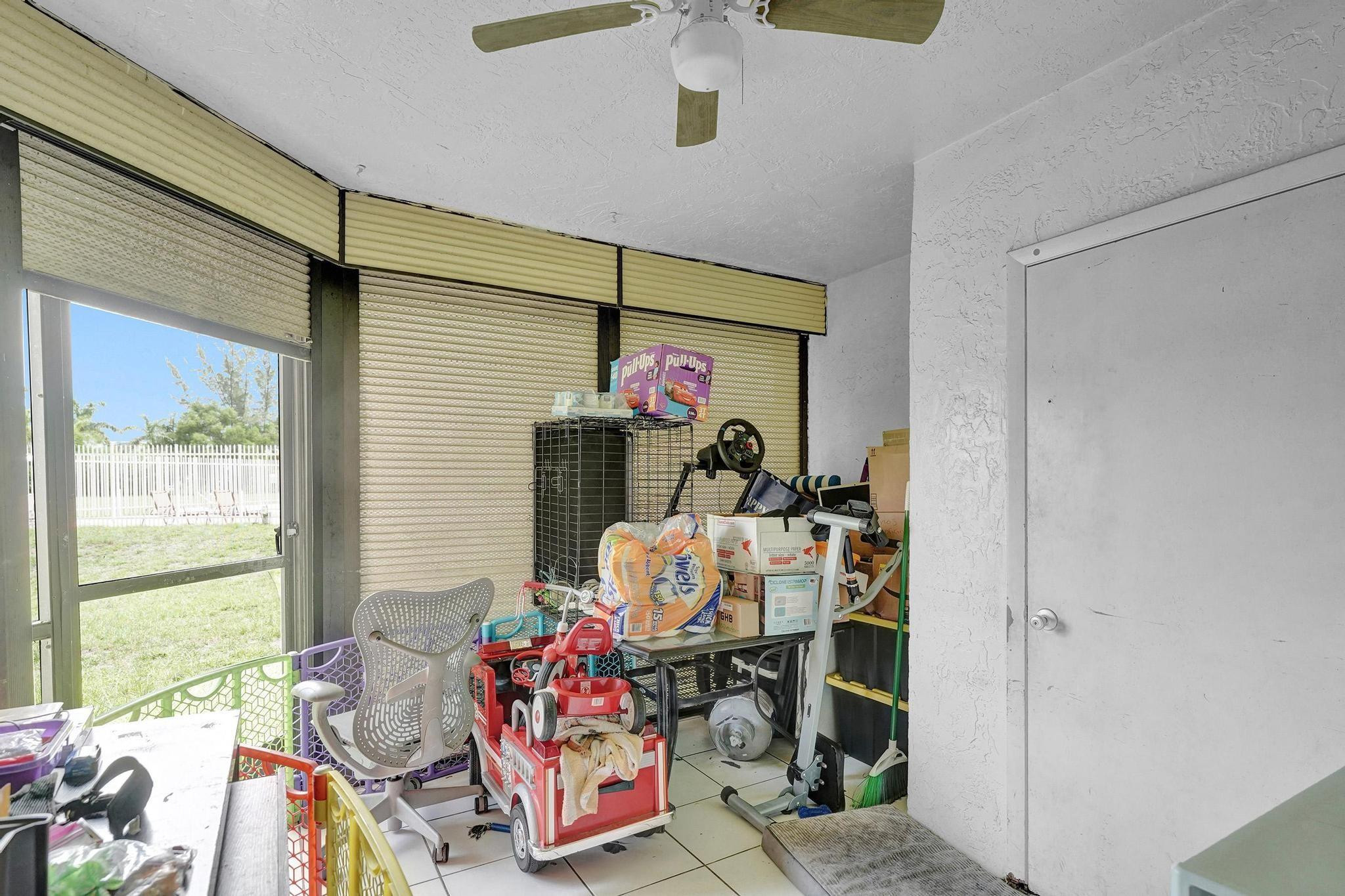 3396 Foxcroft Road, Unit 106 Miramar, FL 33025 - Photo 17 of 24 a bedroom with furniture and a window