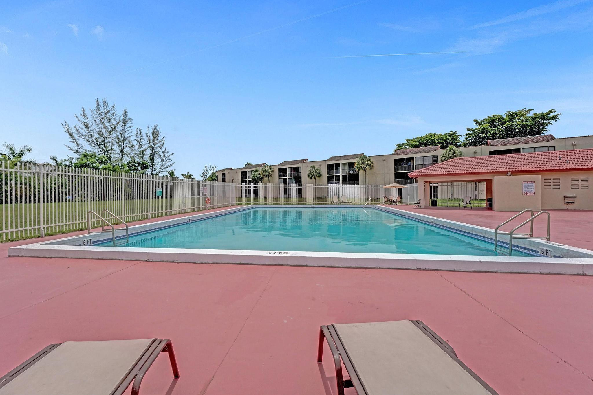 3396 Foxcroft Road, Unit 106 Miramar, FL 33025 - Photo 22 of 24 a view of a house with a yard