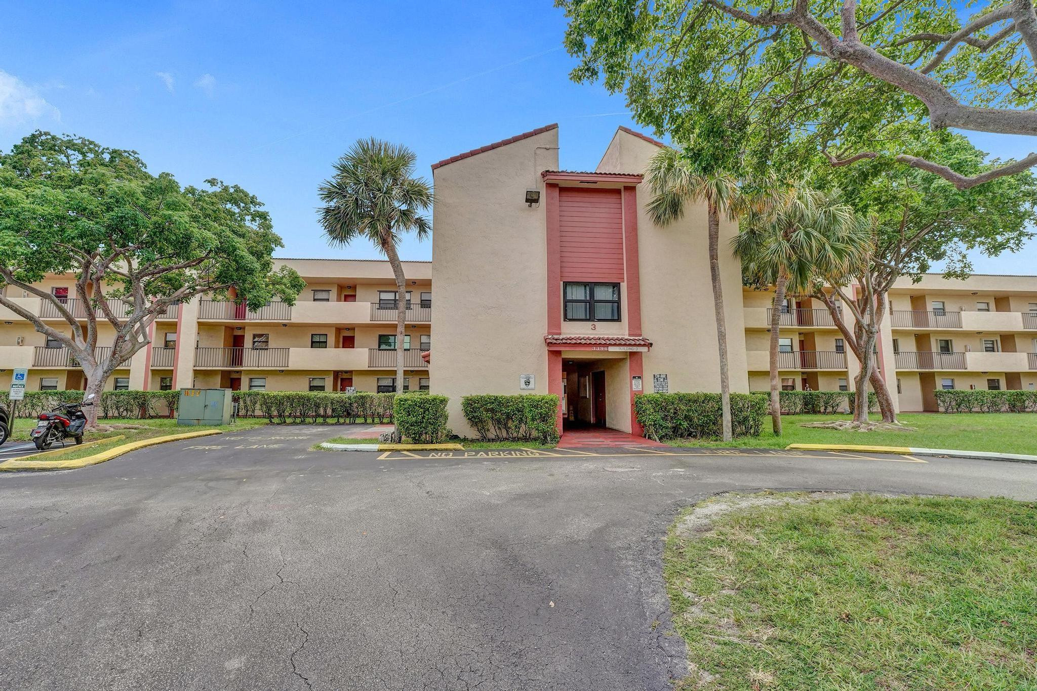3396 Foxcroft Road, Unit 106 Miramar, FL 33025 - Photo 23 of 24 front view of a house with a yard