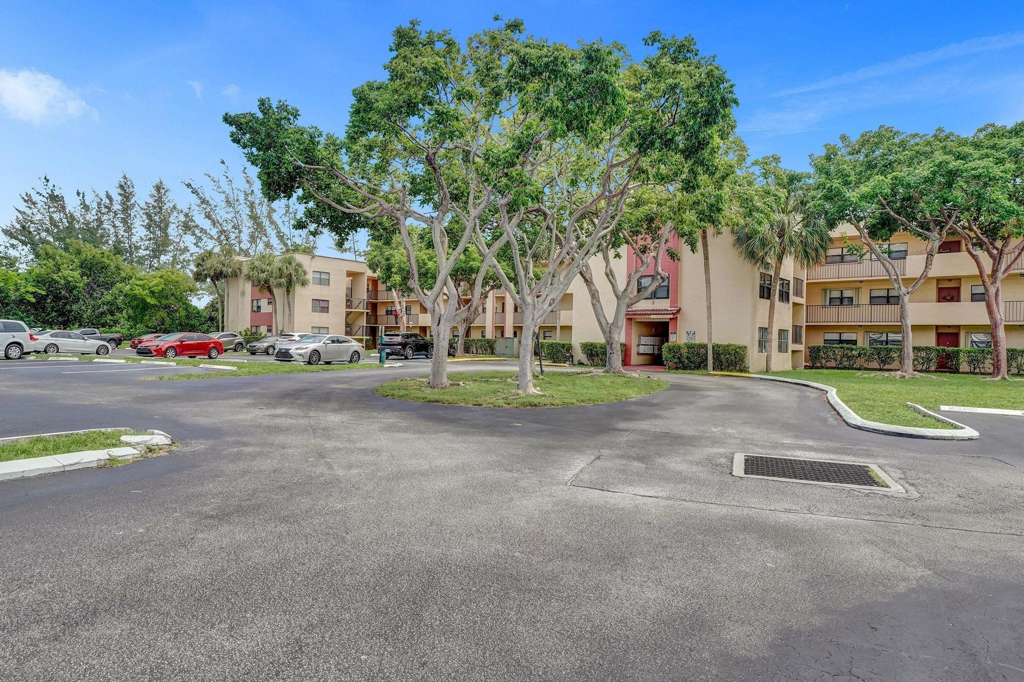 3396 Foxcroft Road, Unit 106 Miramar, FL 33025 - Photo 24 of 24 a view of road with house and trees in the background