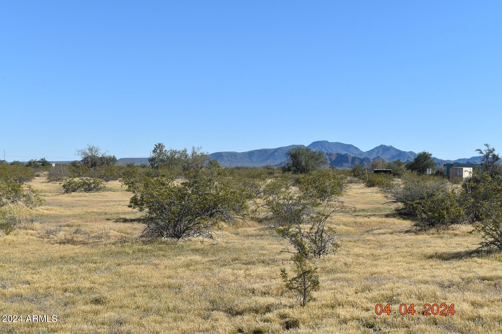 524-xx West Organ Pipe Road, Unit B Maricopa, AZ 85139 - Photo 5 of 9 a view of a lake with mountains in the background